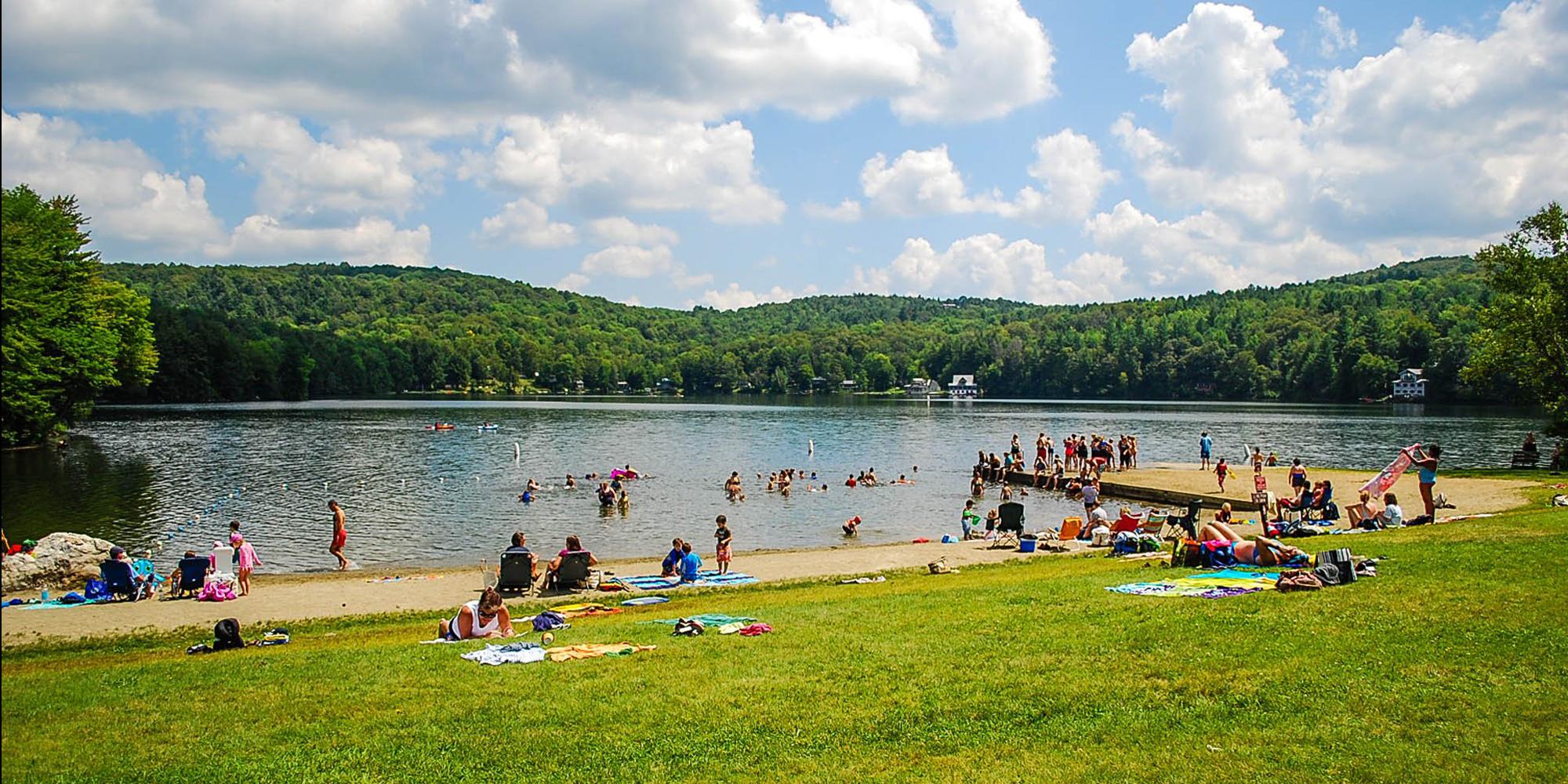 Visitors enjoy the water at Silver Lake State Park