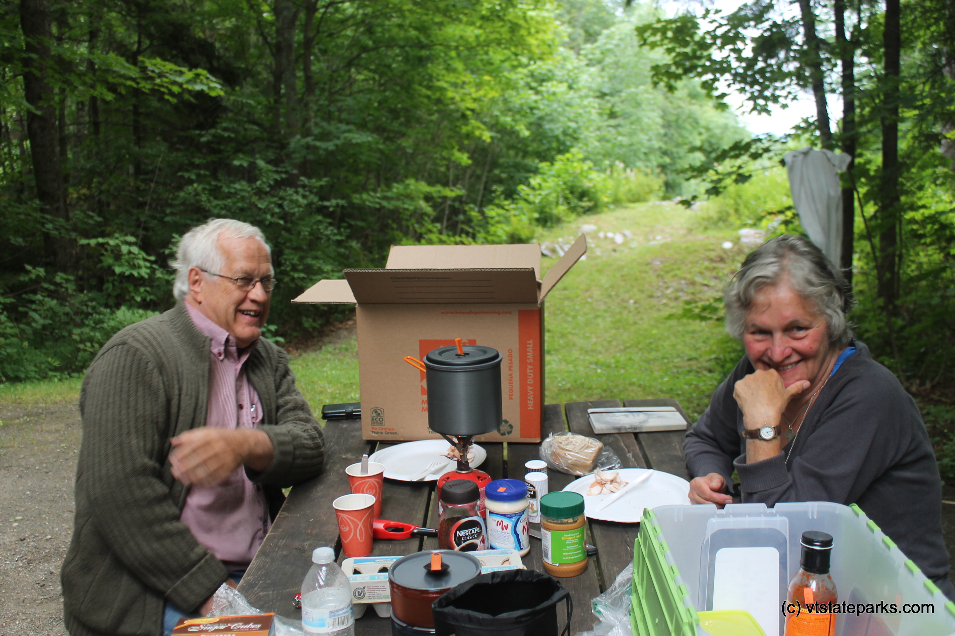 Couple enjoying a picnic lunch at Allis State Park by Alexa Collesides