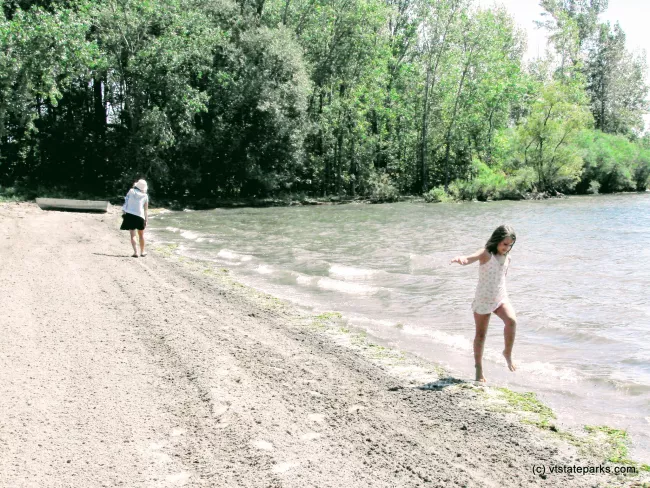 Mother and daughter walking the beach at Knight Point State Park