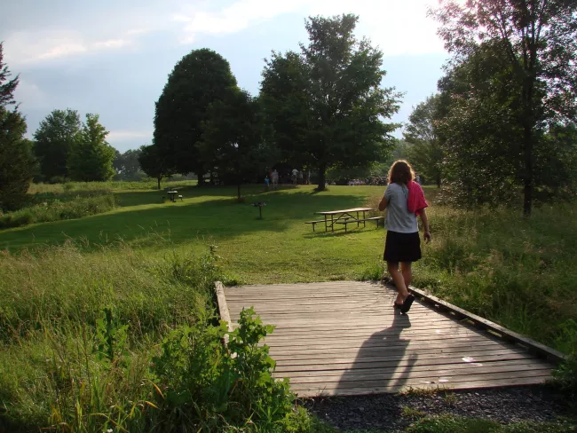 Walking over the bridge at Knight Point State Park by Sarah Hayes