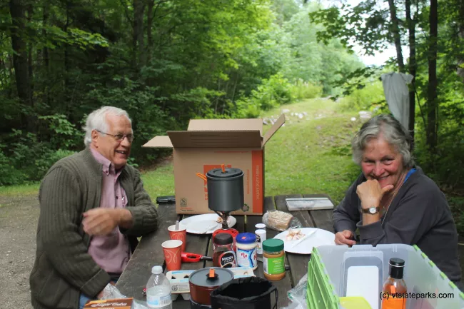 Couple enjoying a picnic lunch at Allis State Park by Alexa Collesides