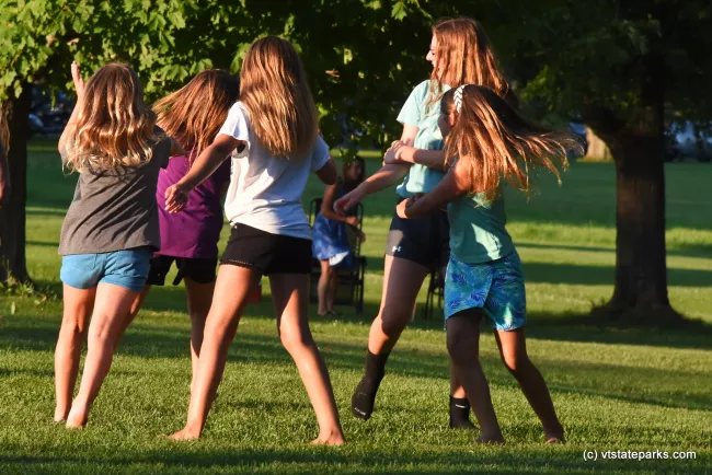 Girls dancing at Knight Point State Park by Raven Schwan-Noble
