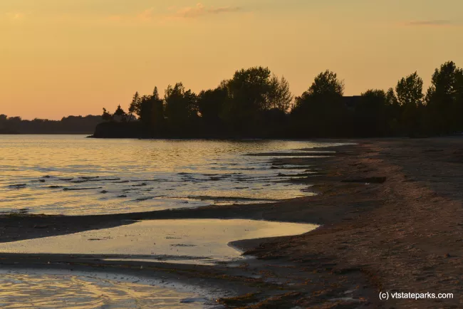 The shore at sunset at Alburg Dunes State Park
