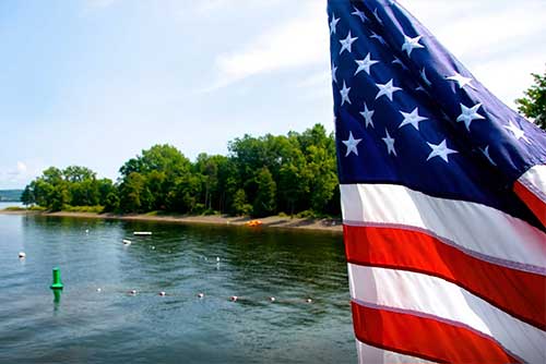 The flag flies over Burton Island State Park (photo credit: Amy Chess)