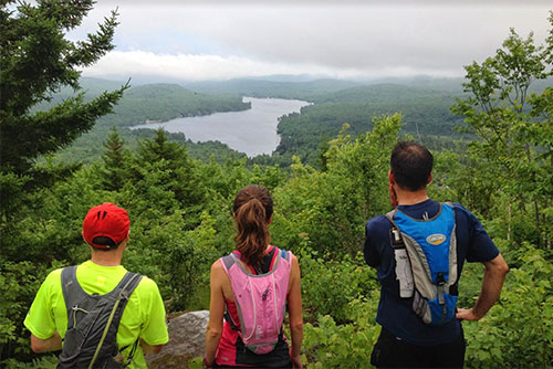 Vermont State Park Trail Runners look out over Kettle Pond