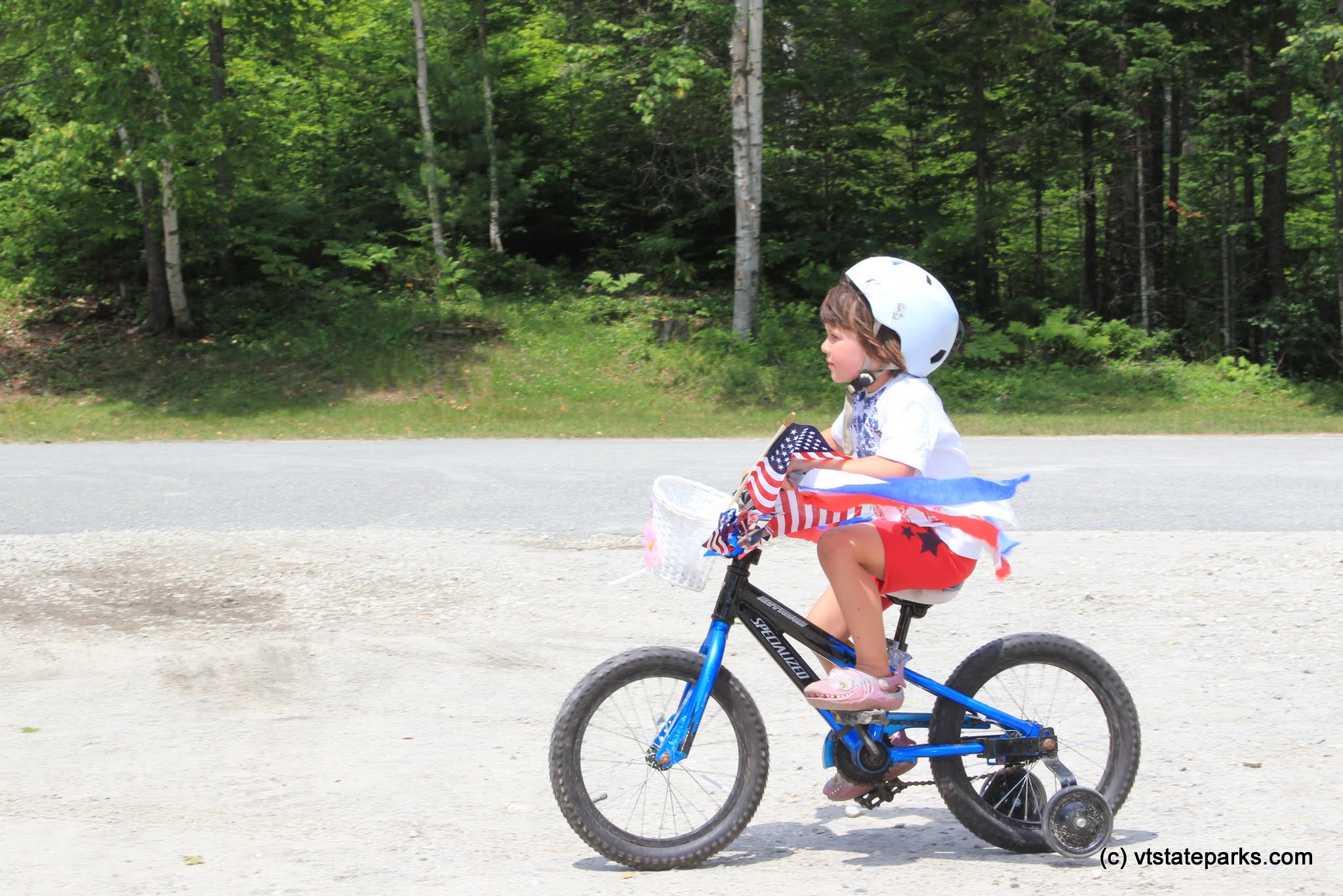 Tiny rider in the 4th of July bike parade at Stillwater State Park by David Jalbert