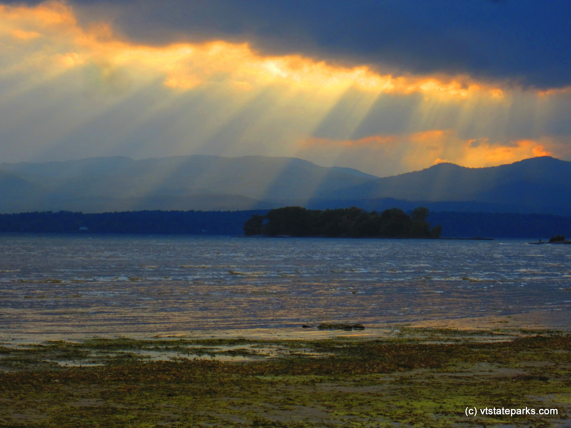 Sun rays on Lake Champlain taken from Button Bay State Park by Tara Schatz