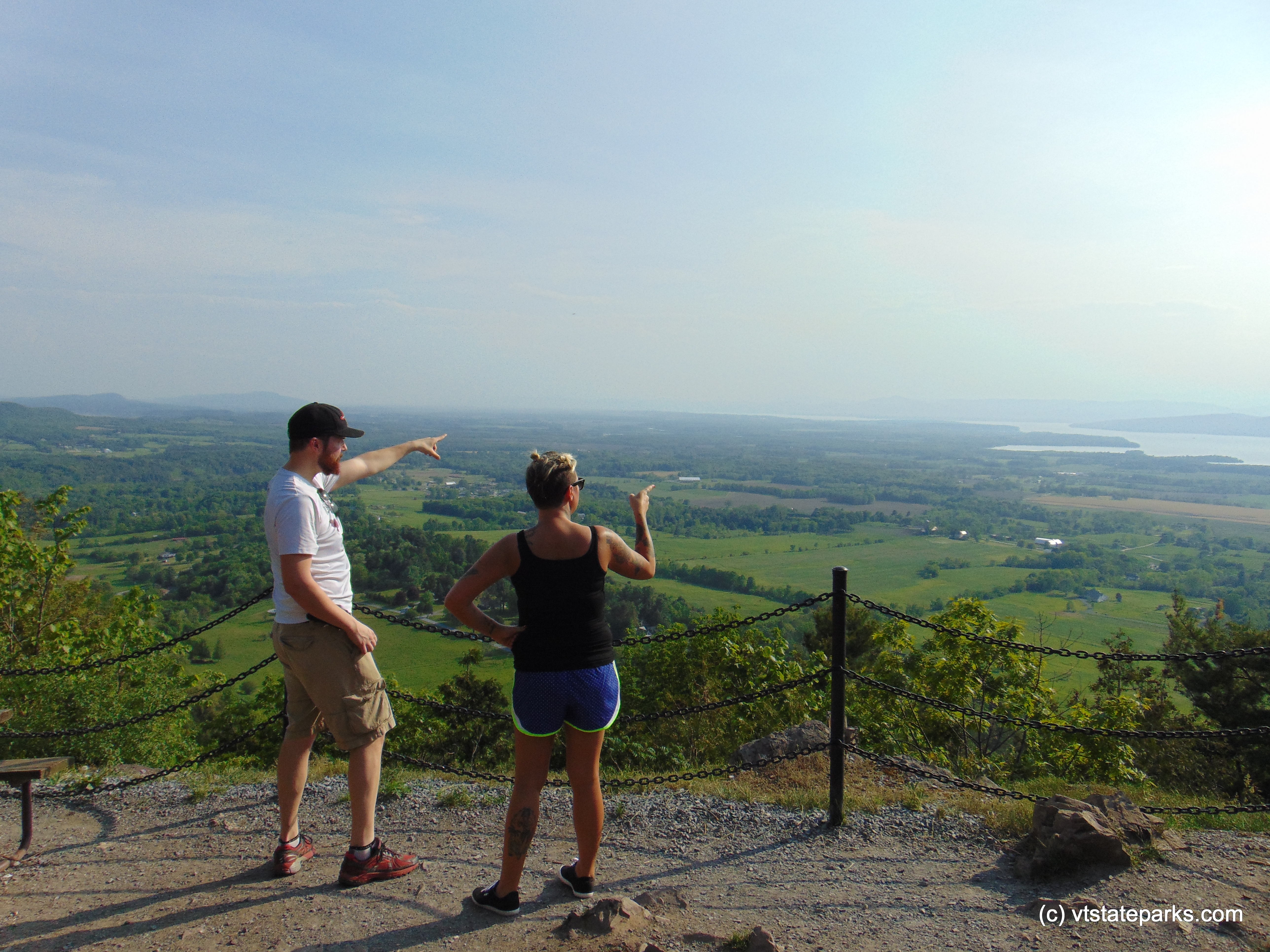 Pointing into the distance from Mt. Philo State Park summit by Belinda Lafountain
