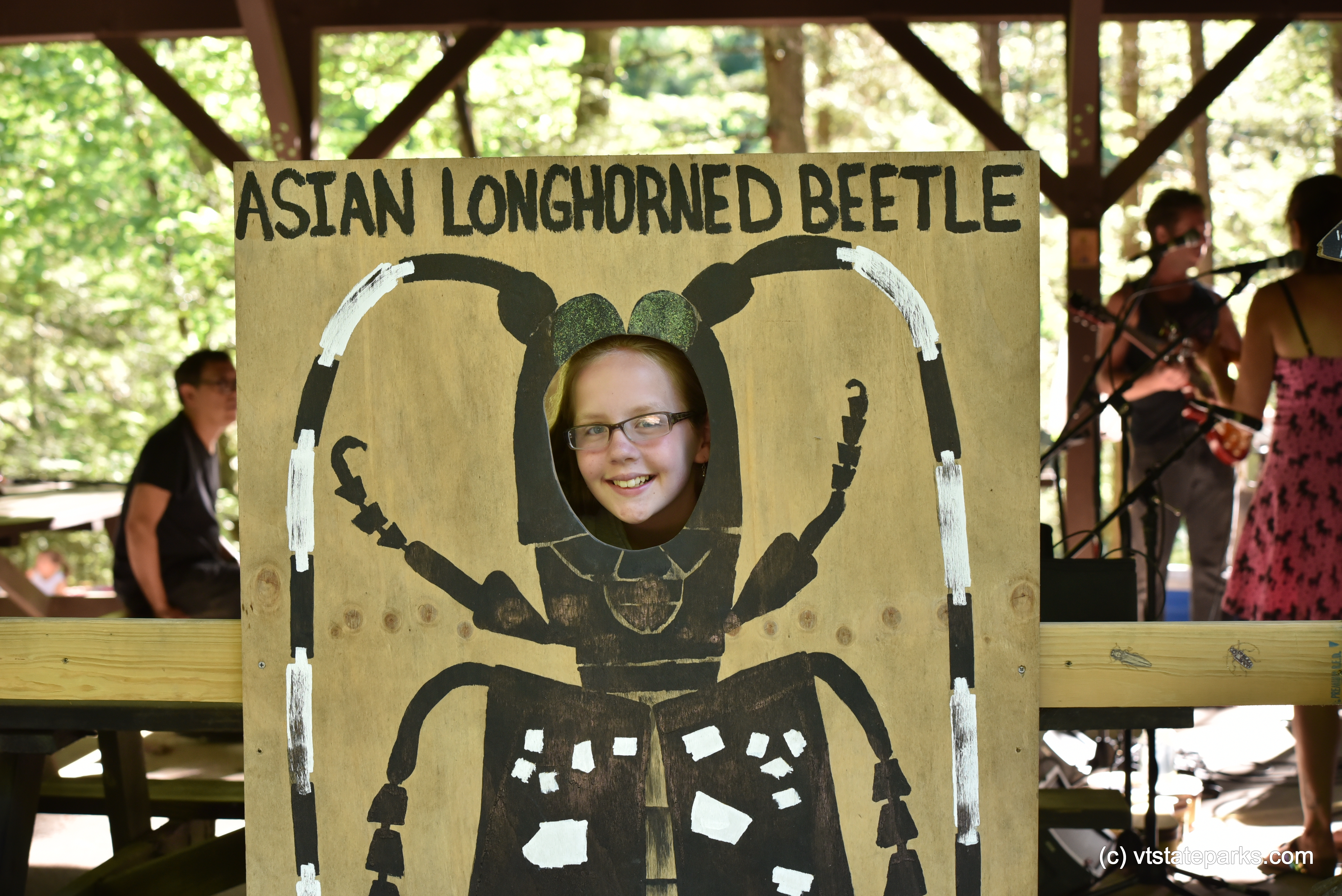 Girl pretends to be an Asian Longhorned Beetle at Jamaica State Park by Bill Steele