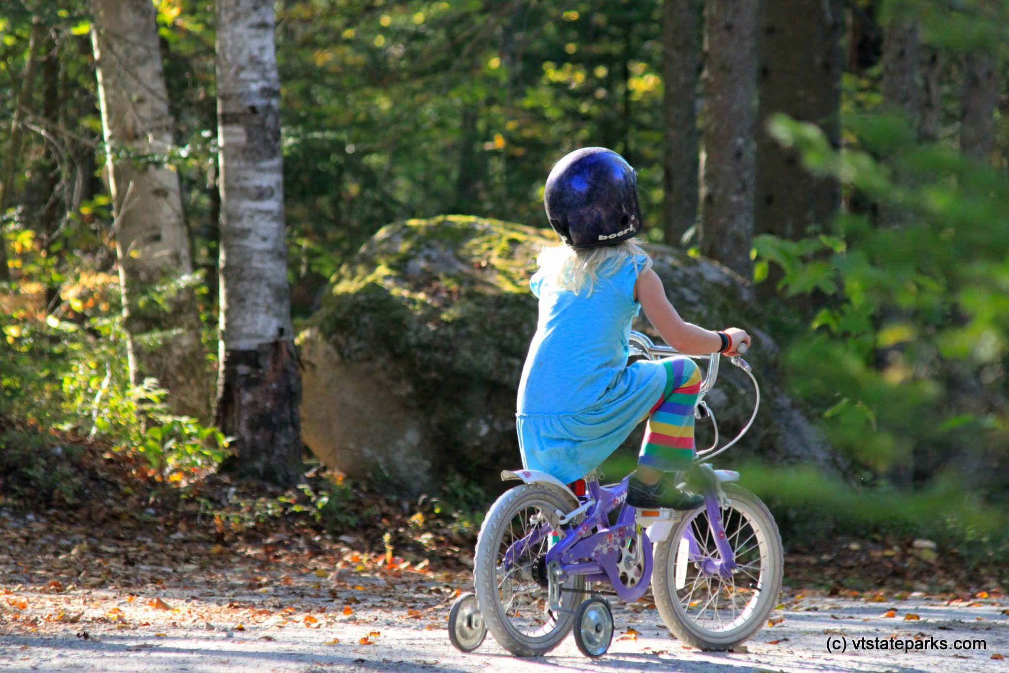 Girl enjoying a bike ride at Ricker Pond State Park by Lene Gary