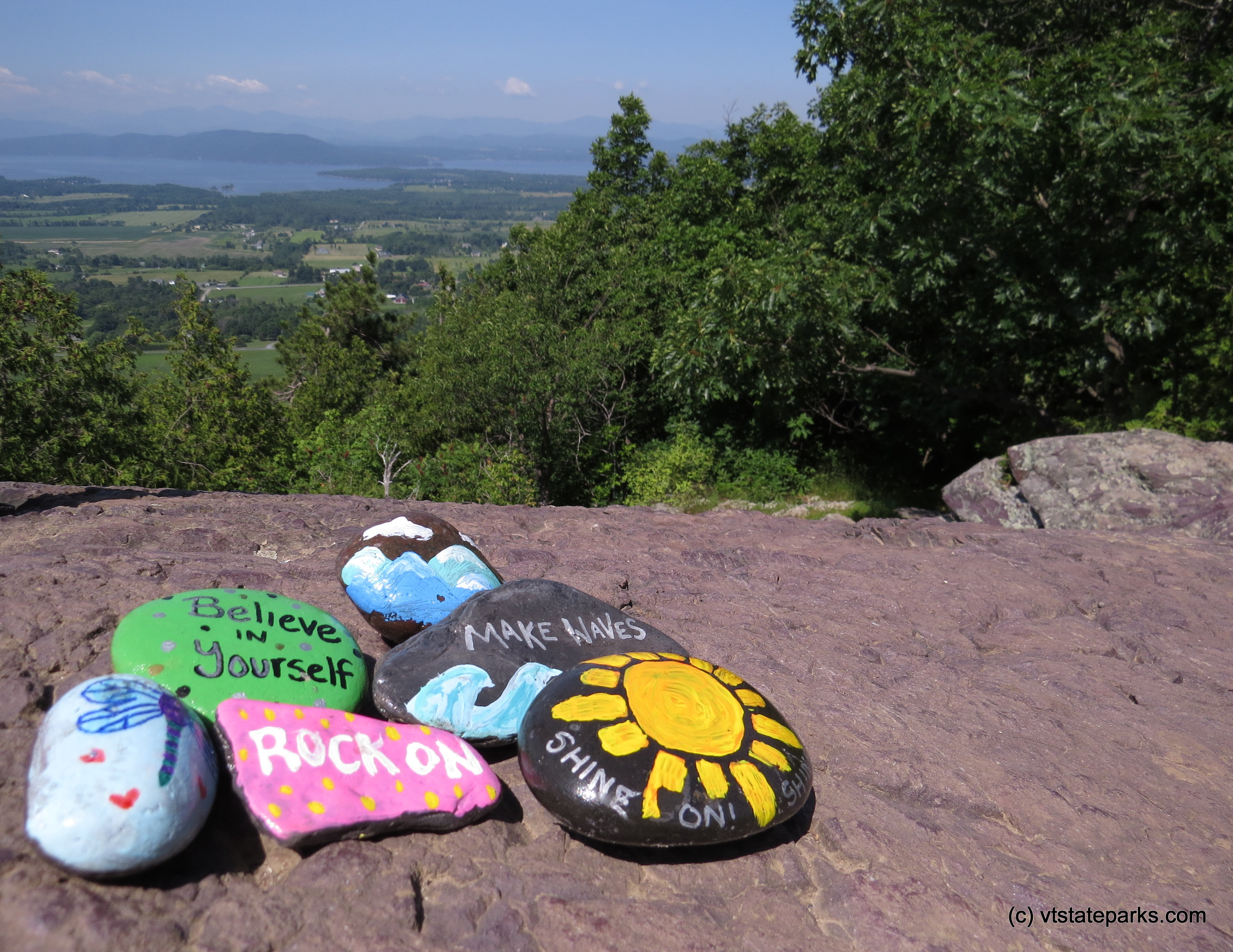 Painted rocks and view from the summit at Mt. Philo State Park by Aswini Cerukuri