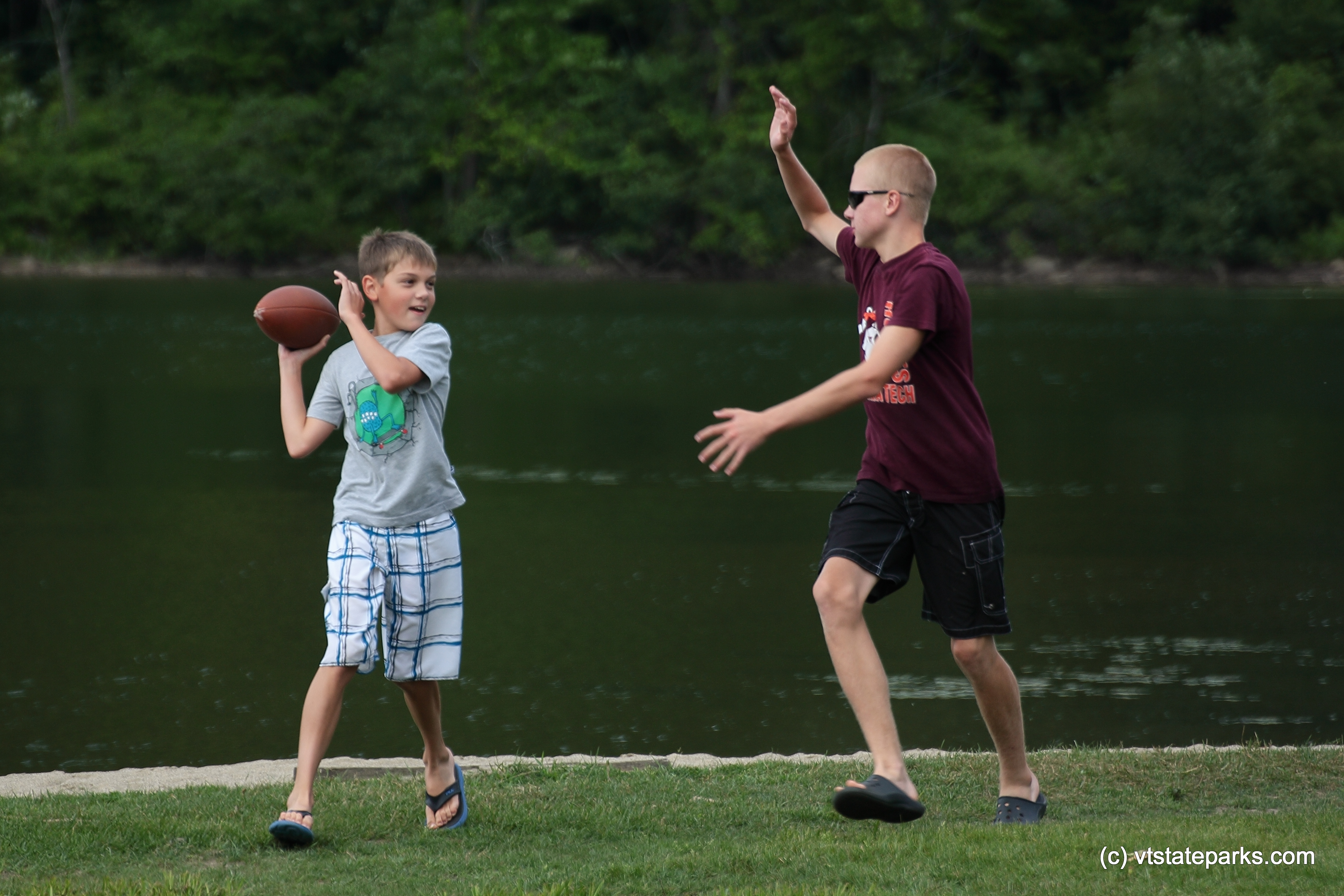 Playing on the beach at Camp Plymouth State Park by Robert Kautz