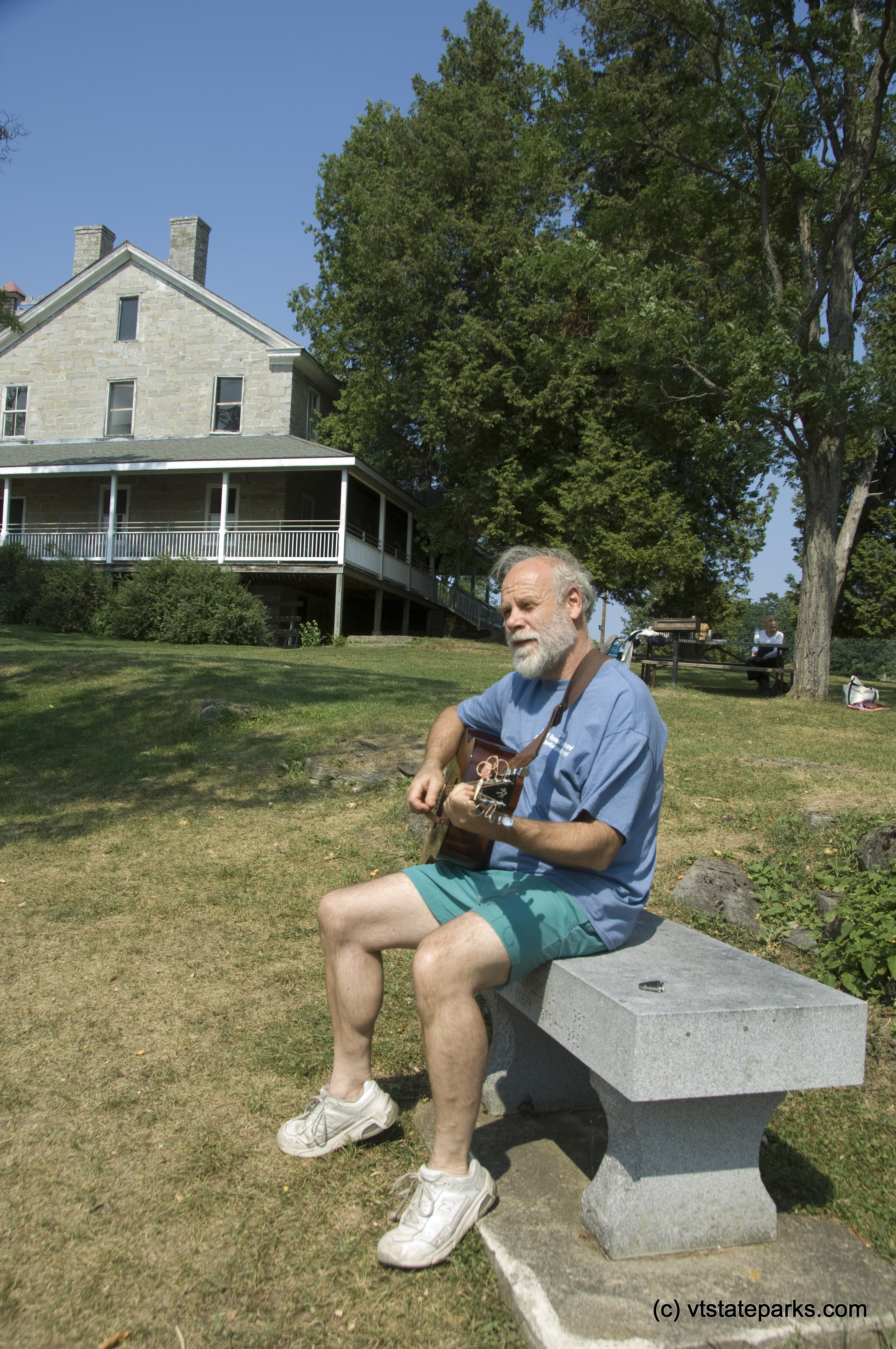 Joe Manley or Brooklyn, NY relaxes with his guitar while visiting Kingland Bay State Park. Photo by Karen Pike