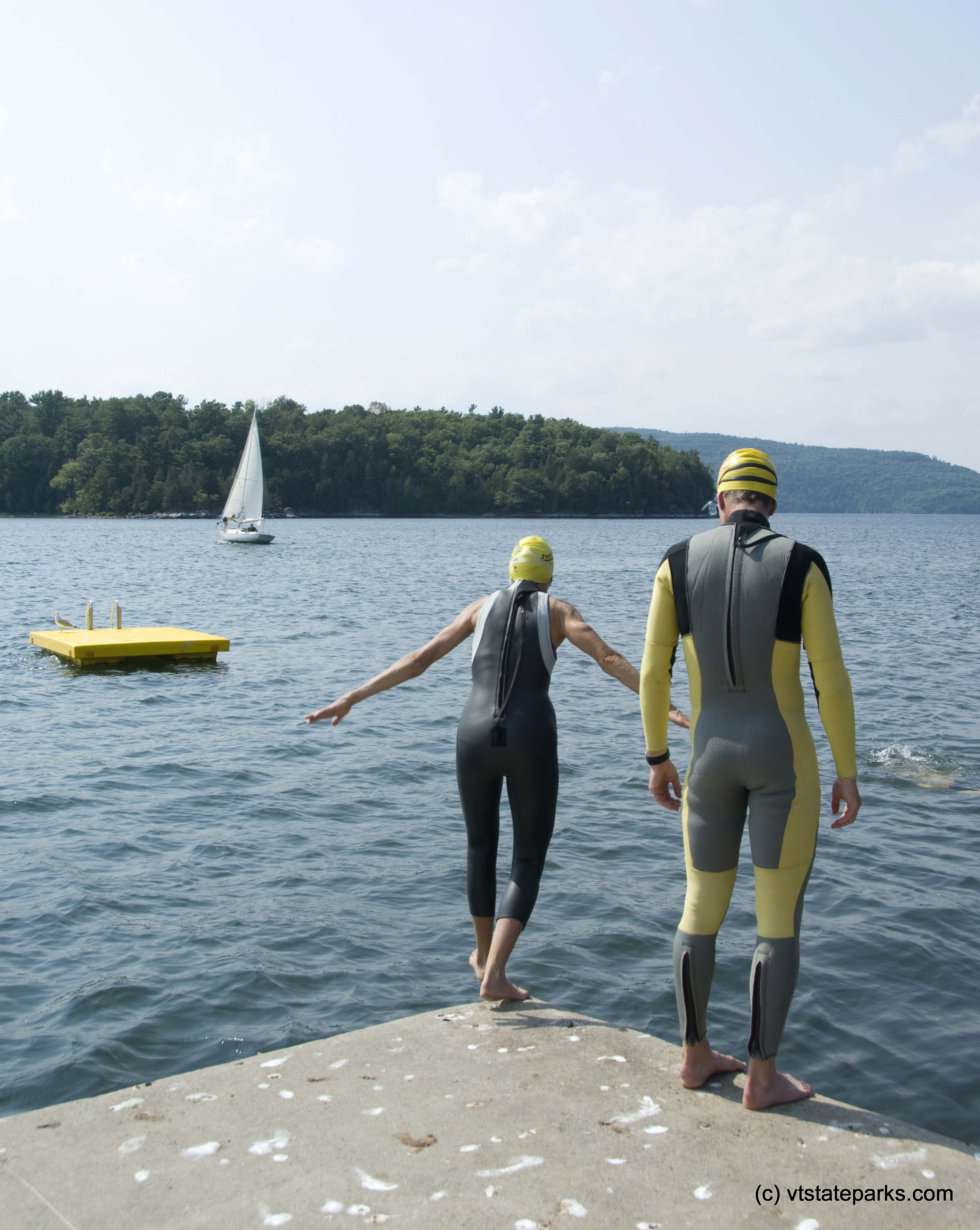 Bill Eichorn, right,  and Lisa Bernardin of Middlebury, Vermont, suit up for a swim at Kingsland Bay Stata Park. Photo by Karen Pike