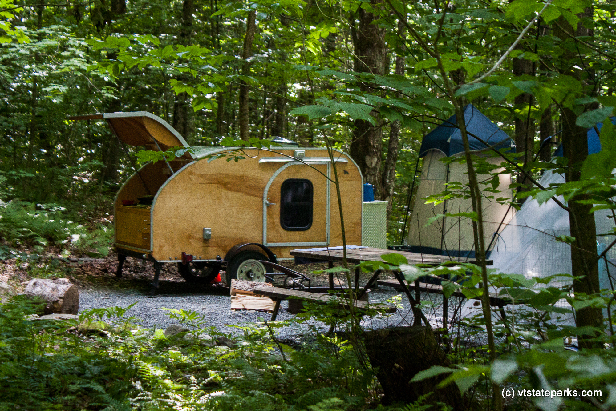 Very cozy camper with an outdoor shower in Molly Stark State Park by Tara Schatz