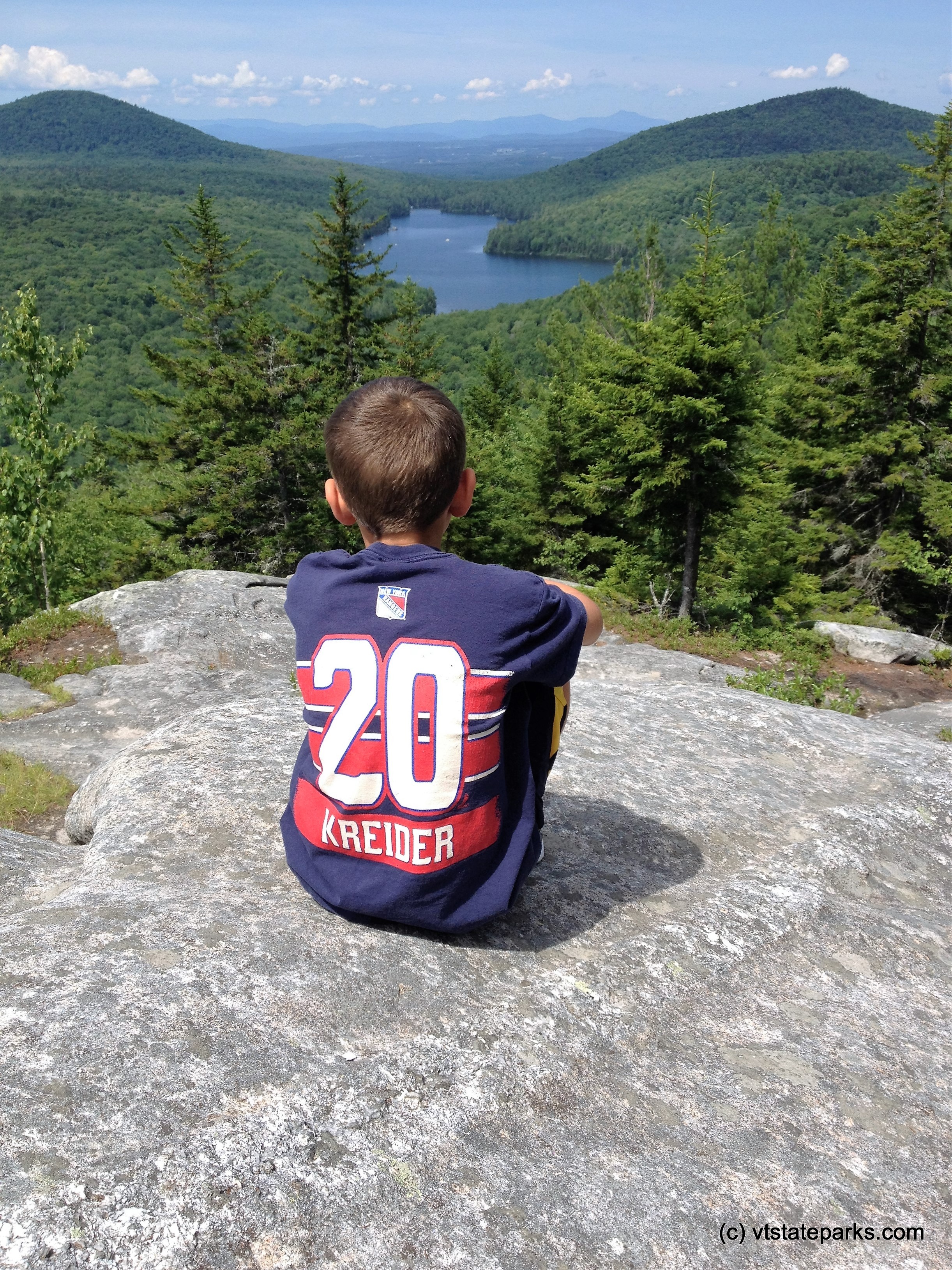 Sitting at the summit of Owl's Head at New Discovery State Park
