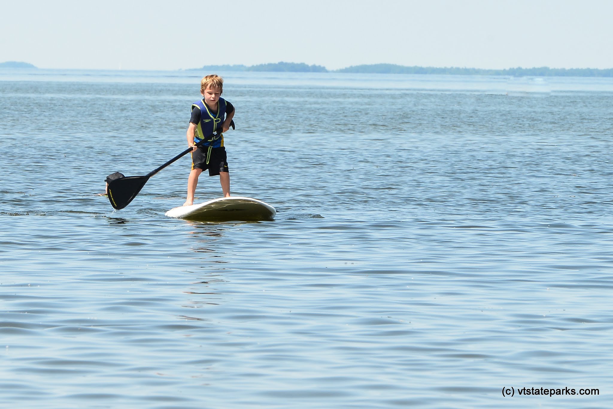 This little guy is during an amazing job paddle boarding at Sandbar State Park by Raven Schwan-Noble