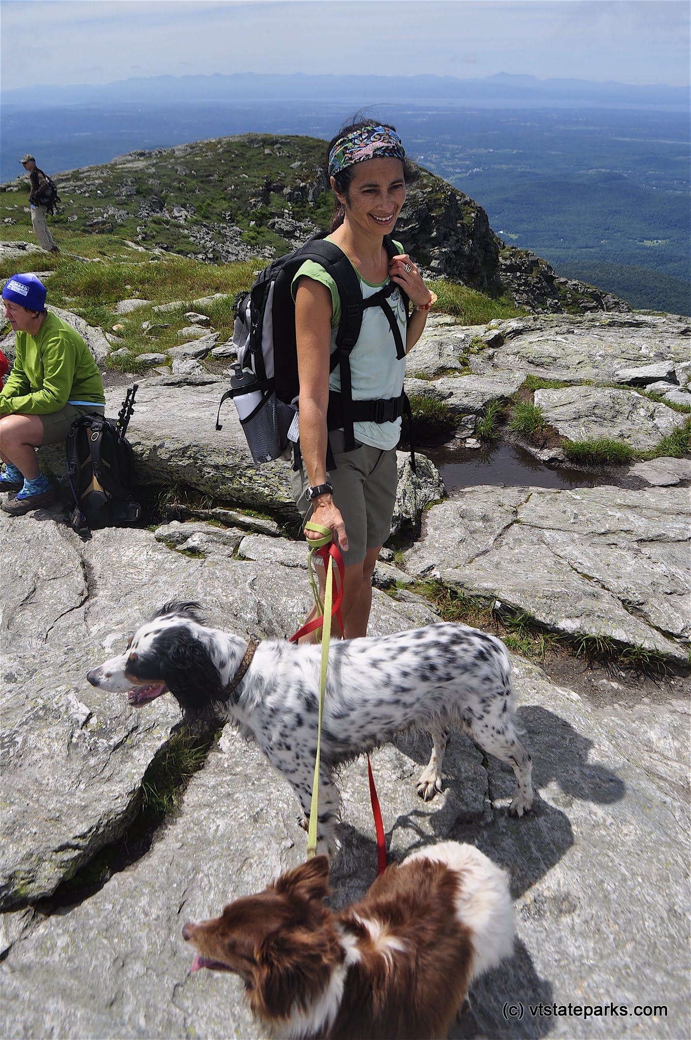 Hiker with dogs at the summit, Underhill State Park