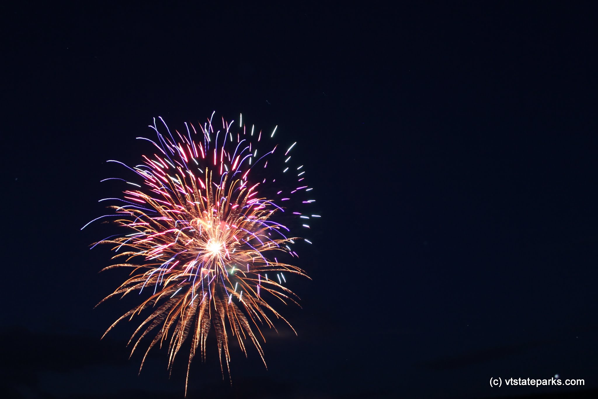 Colorful bright fireworks at Stillwater State Park by David Jalbert