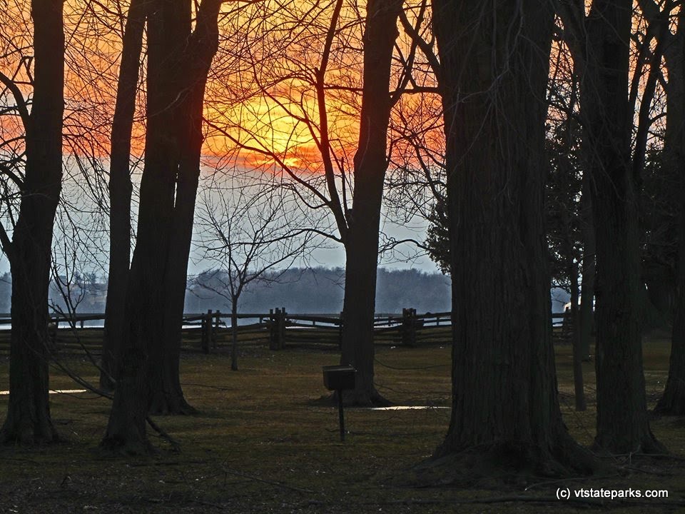 A spring sunset at Sand Bar State Park by Tina Greco Valentinetti.
