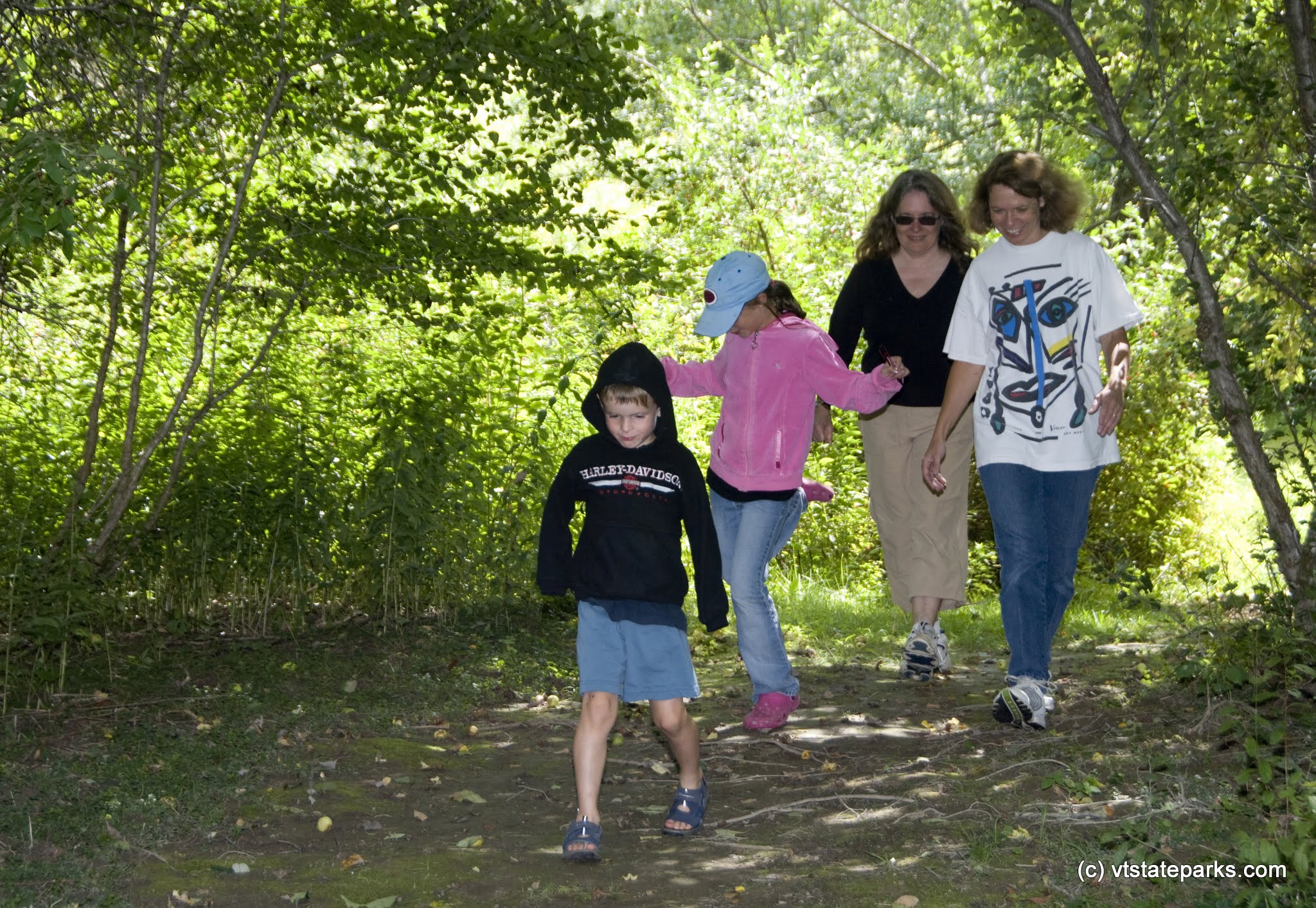 Kitty Goldberg, her children Scott and Zeph Watkins and Ronda Anderson of New York walk the trails at Waterbury Ctr State Park. Photo by Karen Pike