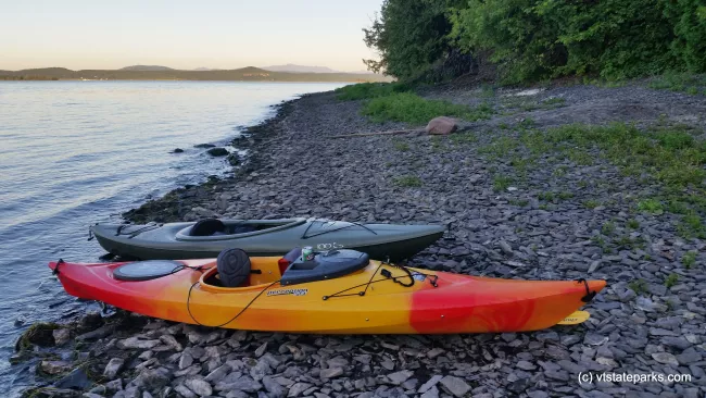 Kayaks on the shoreline of Lake Champlain at Grand Isle State Park by Matt Parsons