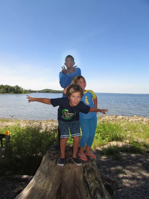 Posing on a stump at Kamp Kill Kare State Park