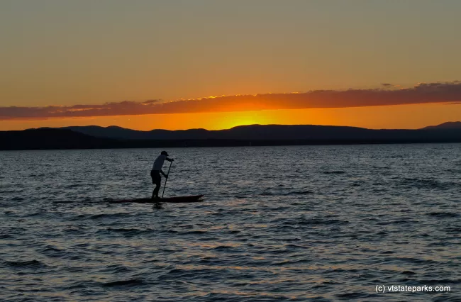 Paddle boating on Lake Champlain from Button Bay Sate Park with a beautiful sunset by Tara Schatz