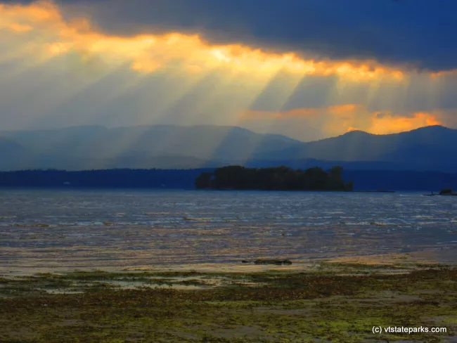 Sun rays on Lake Champlain taken from Button Bay State Park by Tara Schatz
