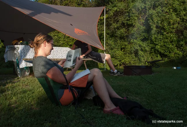 Relaxing and reading at Button Bay State Park by Tara Schalz