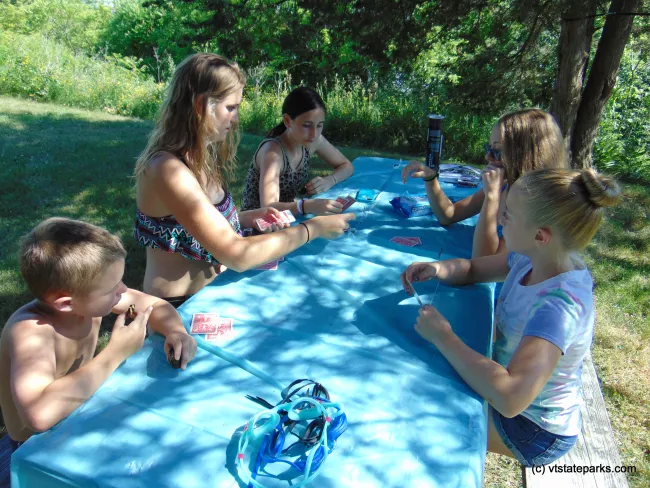 Playing card games at Button Bay State Park by Belinda Lafountain