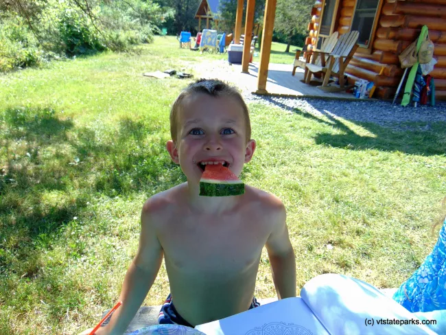 Grinning over fresh melon at Button Bay State Park by Belinda Lafountain