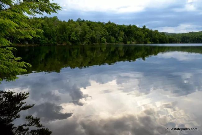 Cloud and tree reflections at Green River State Park by Alexandra Martin