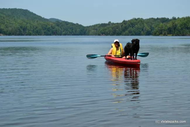 Kayaker with dog friend at Green River Reservoir State Park by Alexandra Martin
