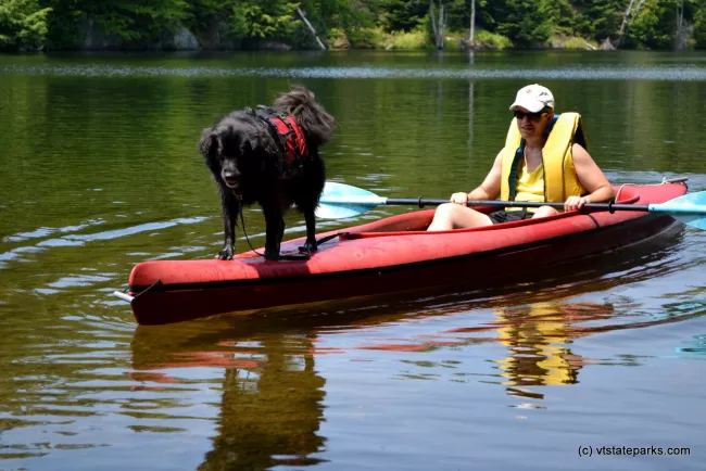 Dog and friend kayaking at Green River Reservoir State Park by Alexandra Martin