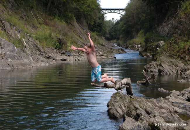 Jumping in at Salmon Hole, Quechee State Park