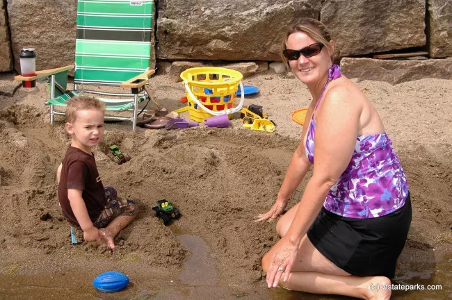 Building sand sculptures at Crystal Lake State Park by Renee McWilliams