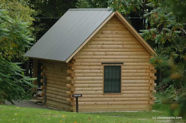 Log cabin at Grand Isle State Park by Patrick Henry