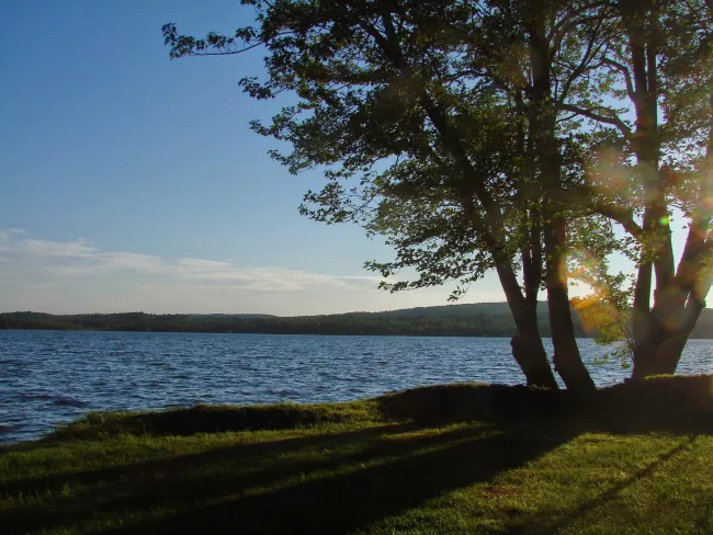 Sunset over the lake at Lake Carmi State Park by Sara Hayes