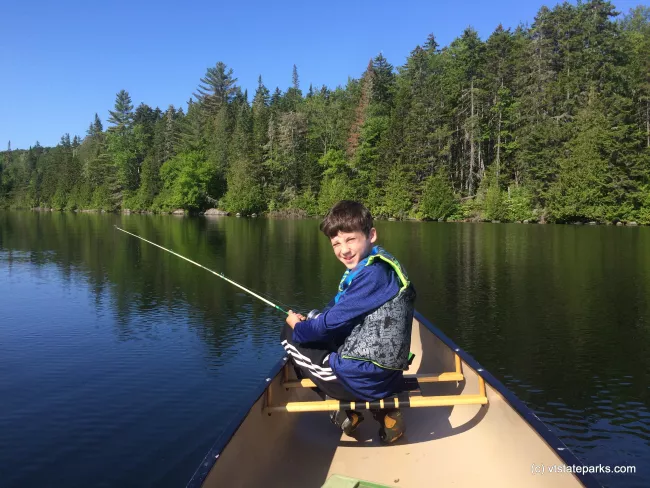 Fishing from a canoe at Maidstone State Park