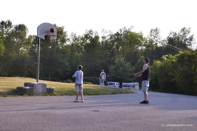 Playing basketball at Grand Isle State Park by Adam White