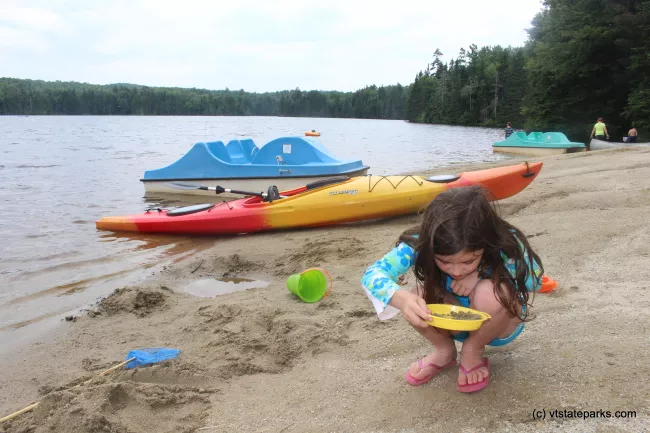 Sifting sand on the beach at Woodford State Park by Jess Lubas