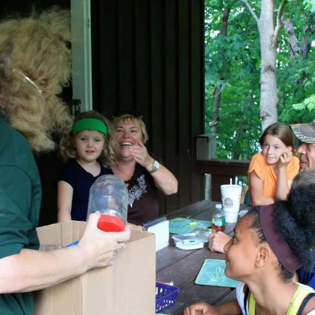 Familes enjoy a program at the nature center