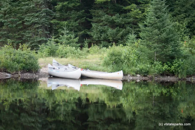Canoes landed on their site at Green River Reservoir by Tara Schatz