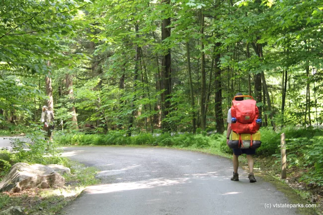 Hiker beginning his hike at Gifford Woods State Park by Isadora Marks