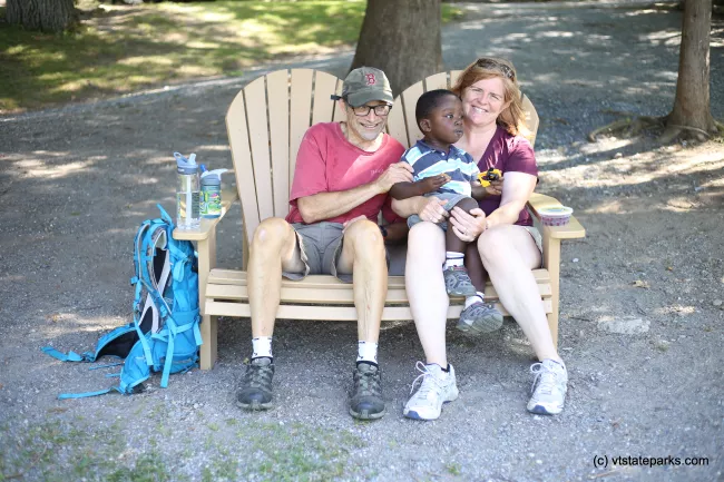 A happy family enjoying a snack break at Mt. Philo State Park by Amanda Vincent