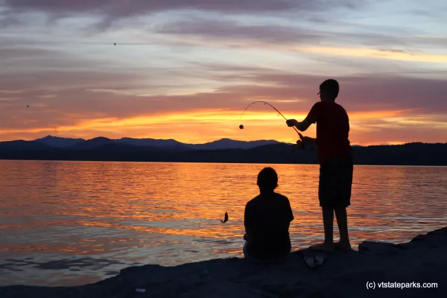 Boys fishing during a beautiful sunset at Button Bay State Park by Amanda Vincent