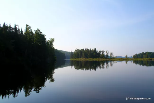 Still water and tree reflections at Green River Reservoir State Park by Jeremiah Johnson