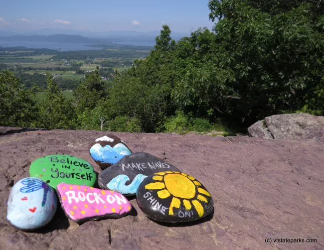 Painted rocks and view from the summit at Mt. Philo State Park by Aswini Cerukuri