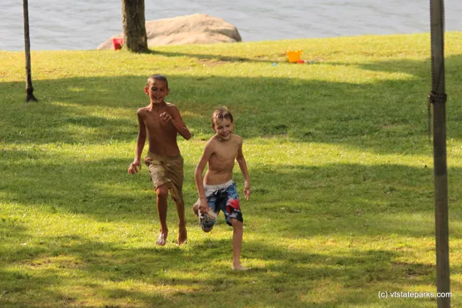 Kids playing near the beach at Boulder Beach State Park by Lene Gary